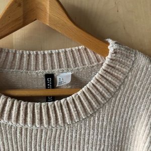 Long-sleeve crew neck chenille sweater.